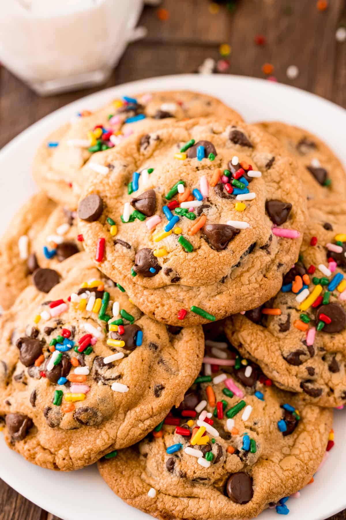 Overhead photo of cookies on white plate showing sprinkles and chocolate chips.