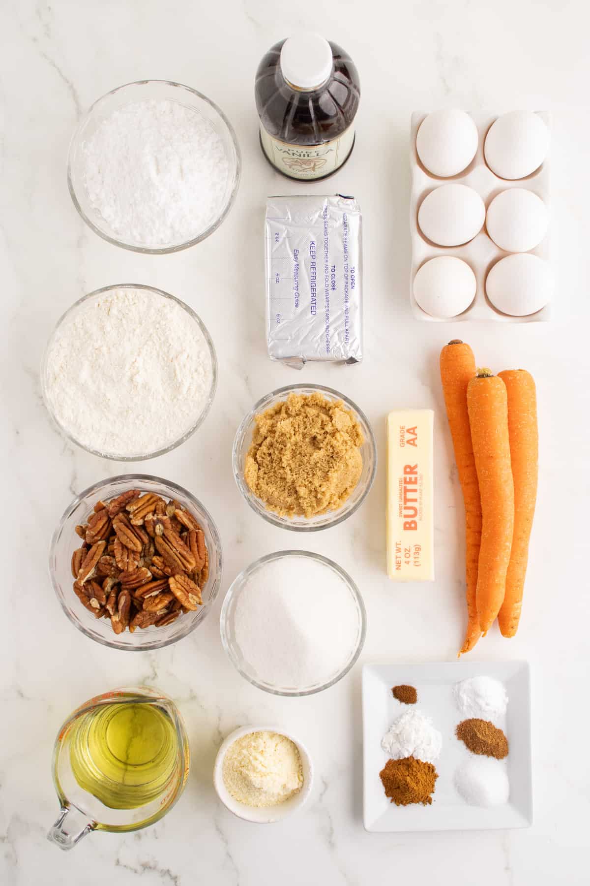 Ingredients needed to make a carrot cake recipe.