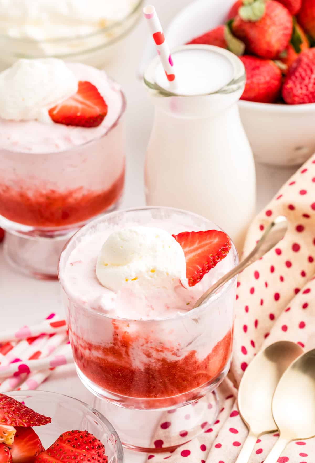Strawberry Mousse in serving dishes with a spoonful taken out.