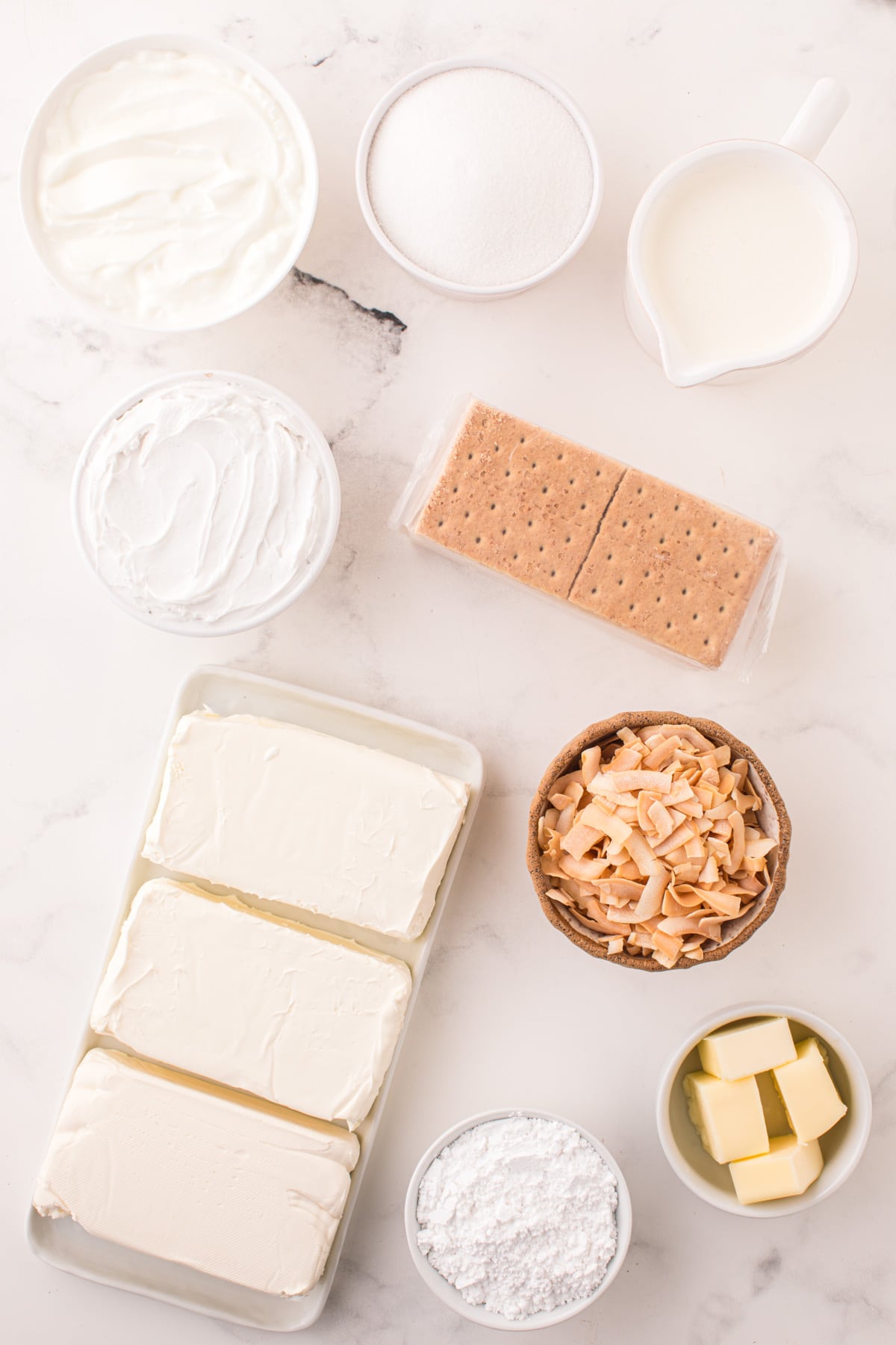 Ingredients needed to make a No Bake Coconut Cheesecake.