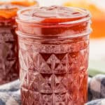Close up square image of sauce in mason jar filled up to the top.