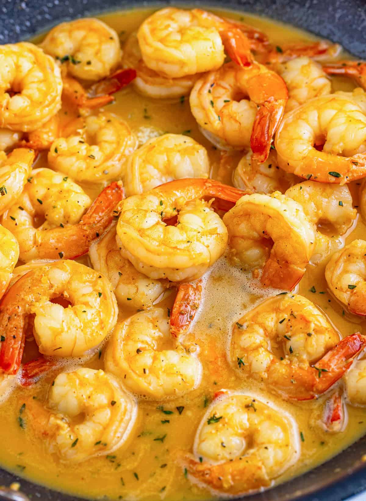 Finished shrimp in pan with sauce.