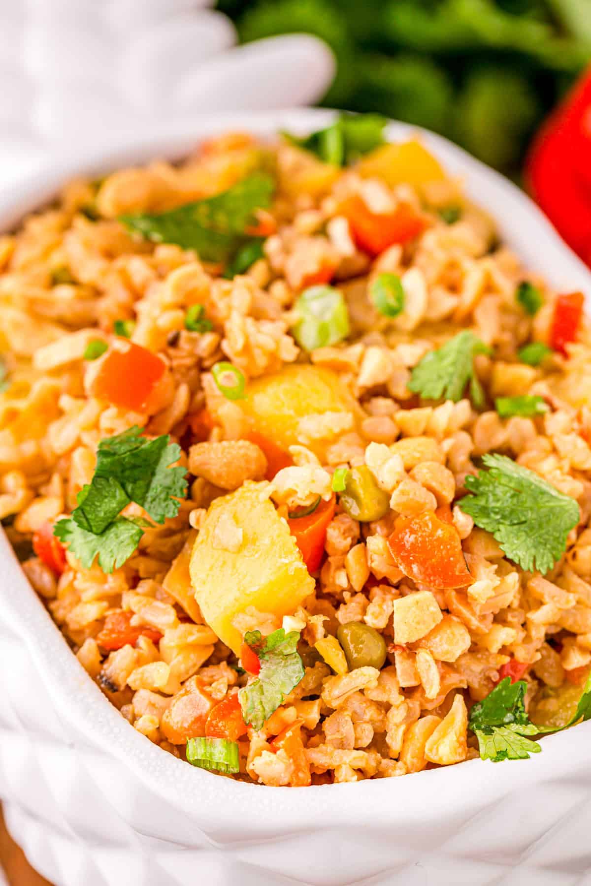 Close up of rice in the pineapple shaped bowl showing off all the ingredients.