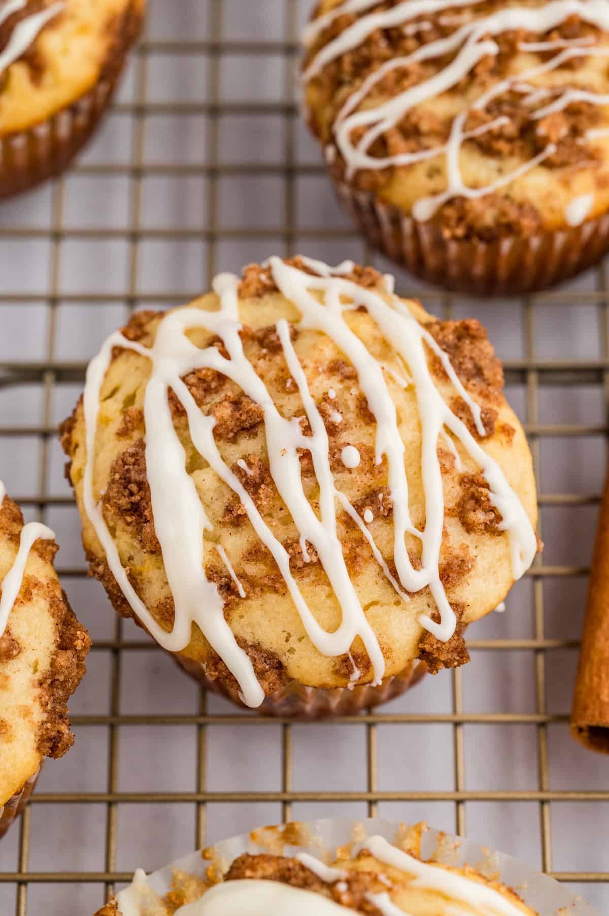 Overhead of glazed muffins on wire rack.