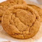 Close up photo of one cookie leaning against others showing off the cinnamon sugar coating.
