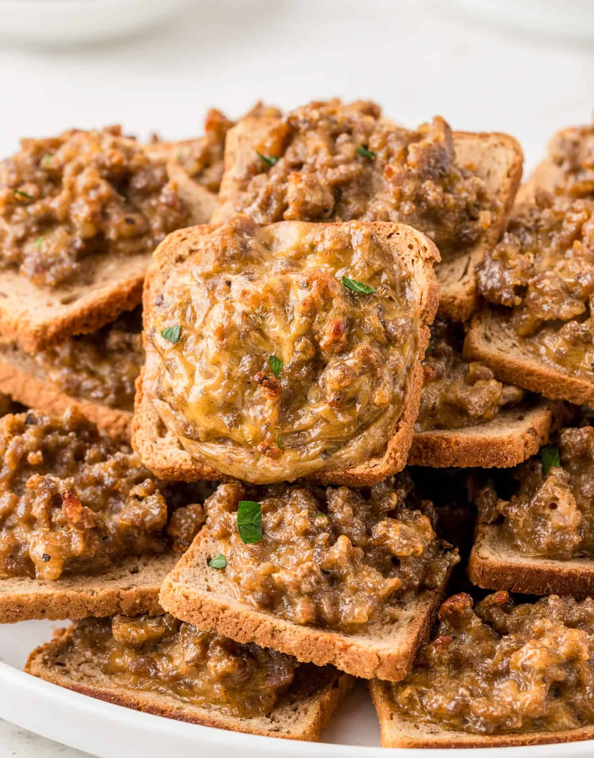 Hanky Panky Recipe close up stacked on plate showing the meat mixture atop the toast.