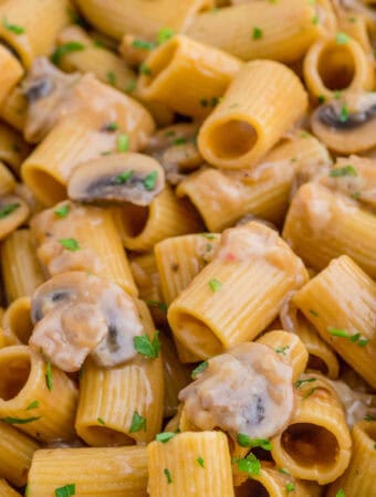 Close up square image of pasta in pan showing all the ingredients.