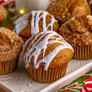 Square image of muffins on white platter.