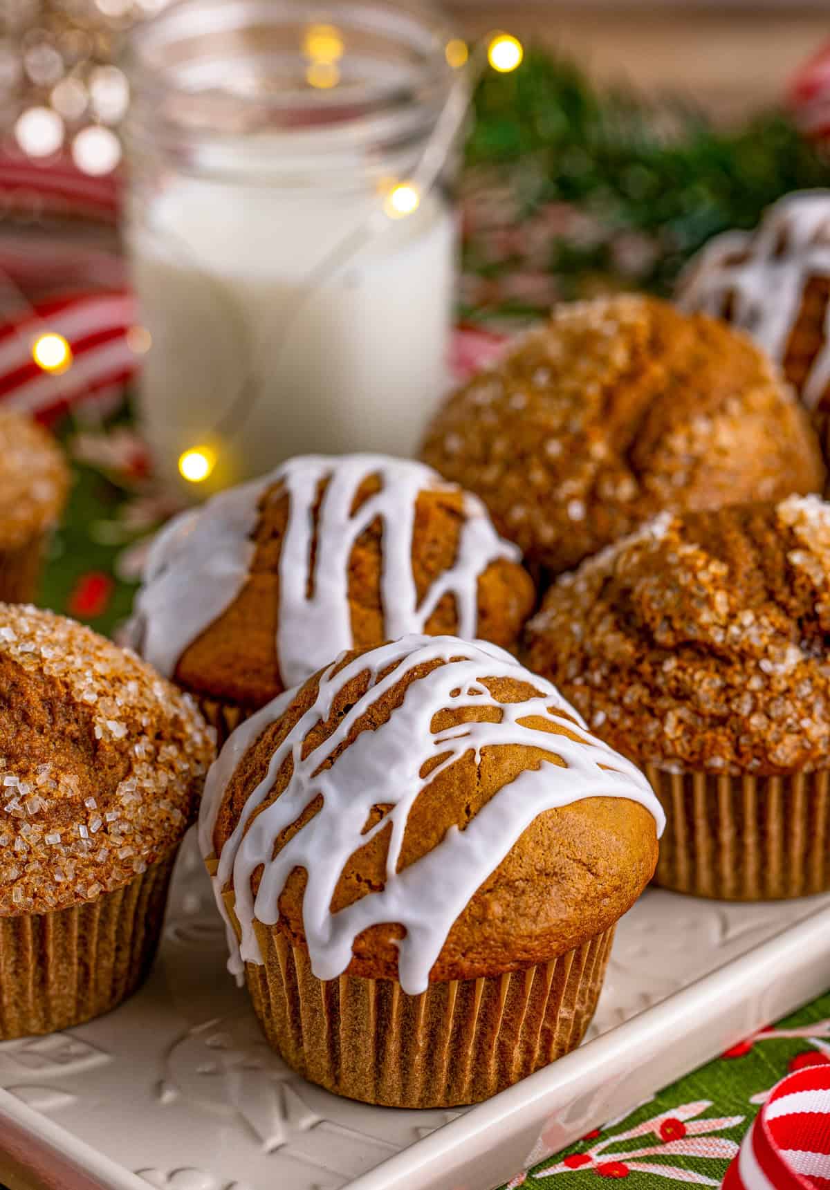 Gingerbread Muffins on white platter. Some with glaze and some with decorators sugar.