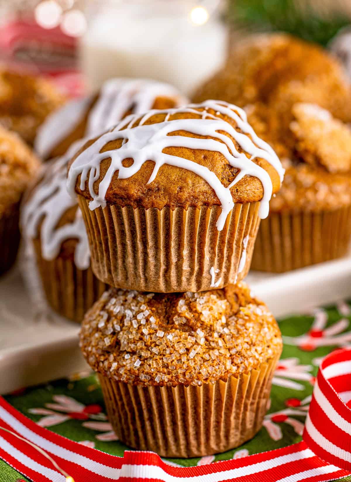 Two stacked Gingerbread Muffins one with glaze and one with decorators sugar.