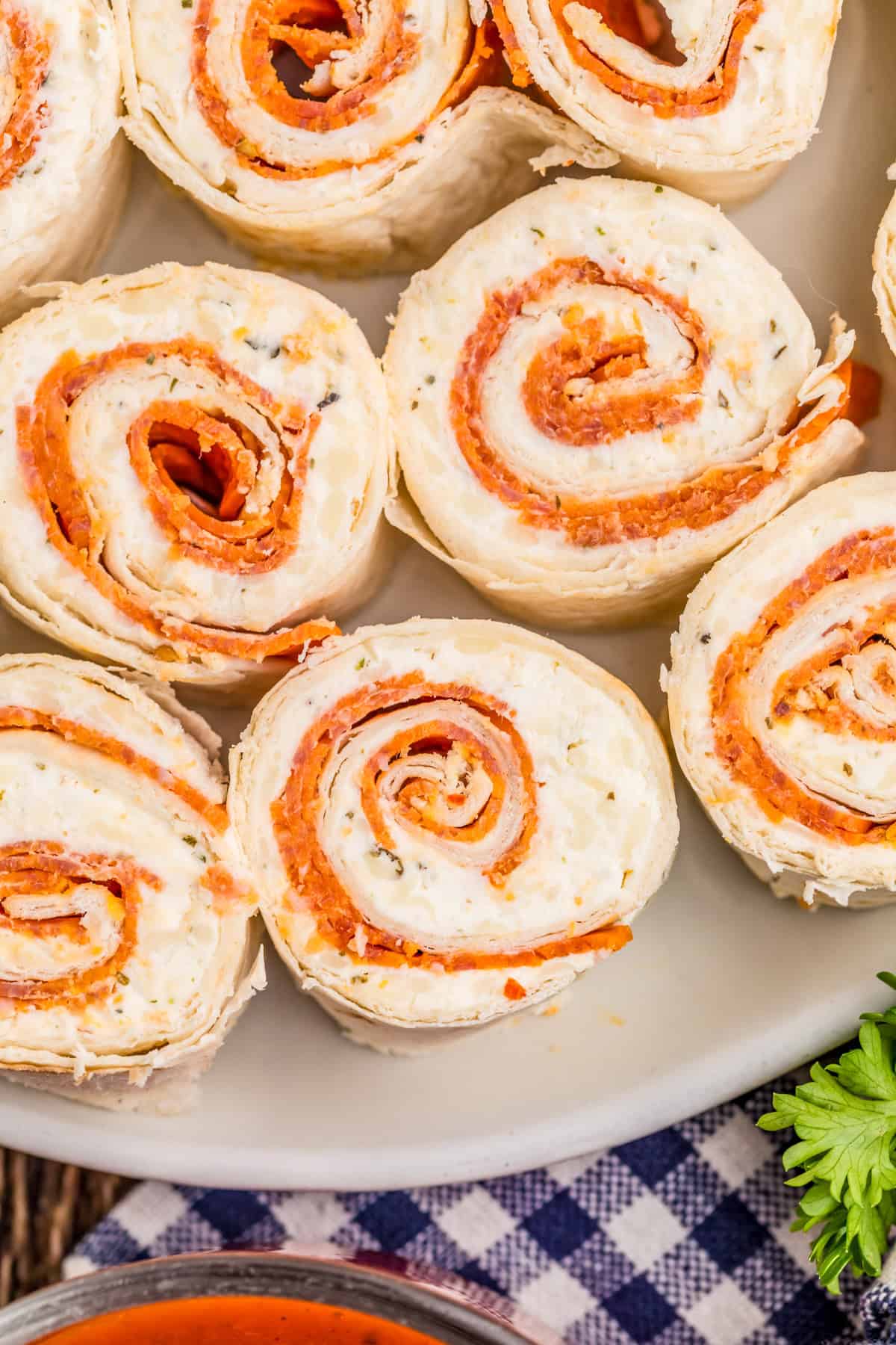 Overhead of pinwheels on plate showing the spiral filling inside.