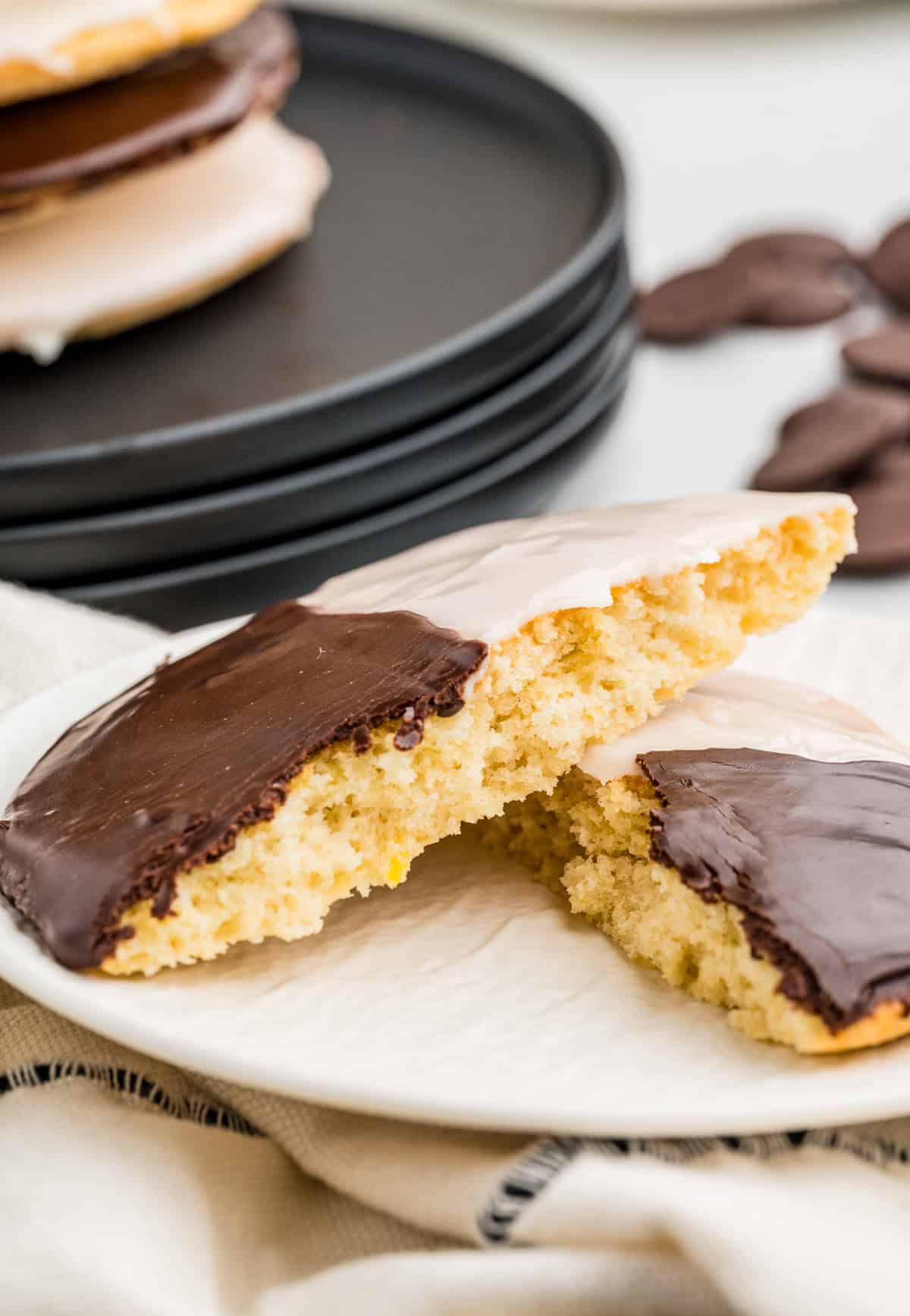 One split cookie on plate showing the inside.