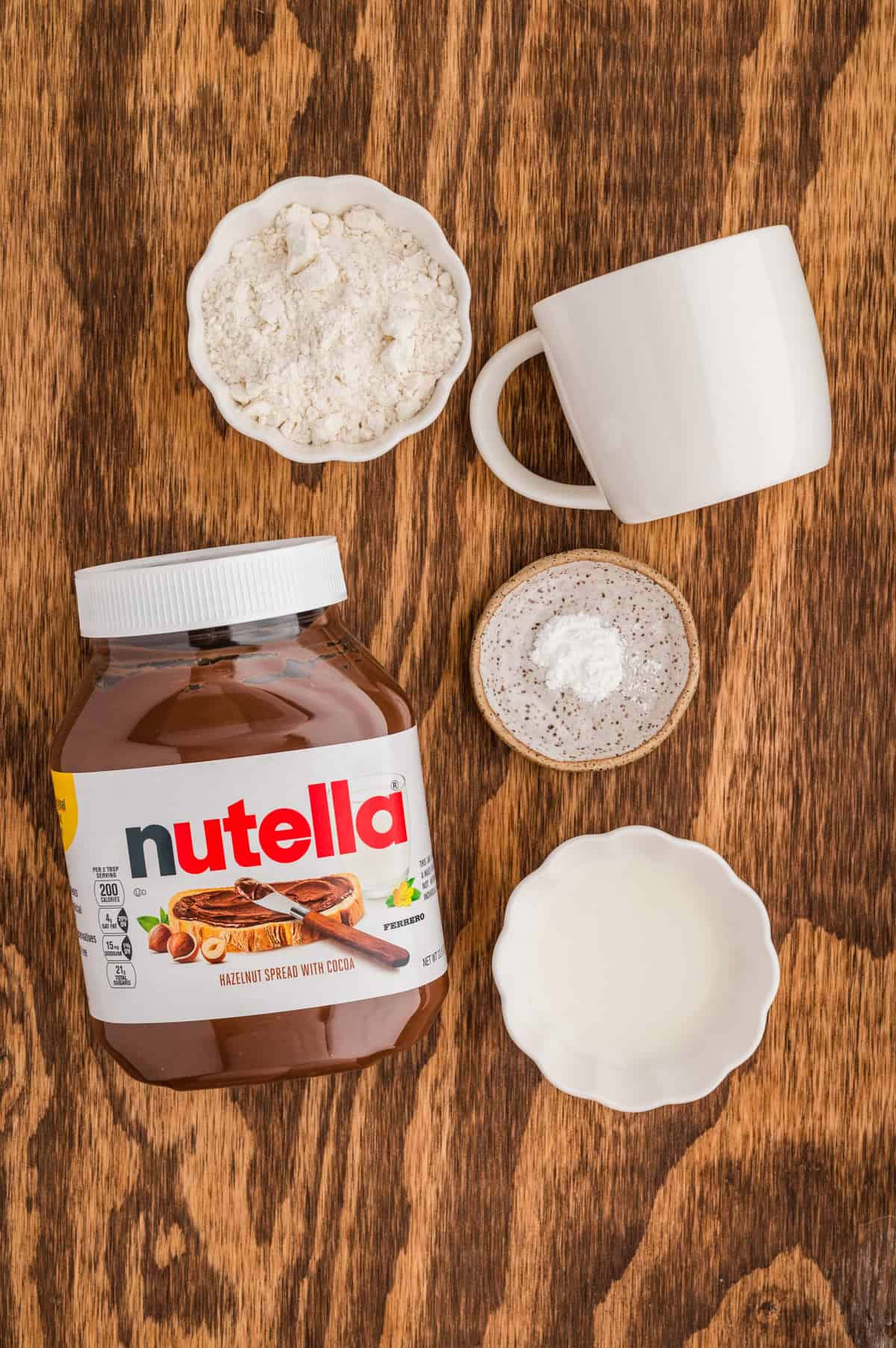 Ingredients needed to make Nutella Mug Cake.