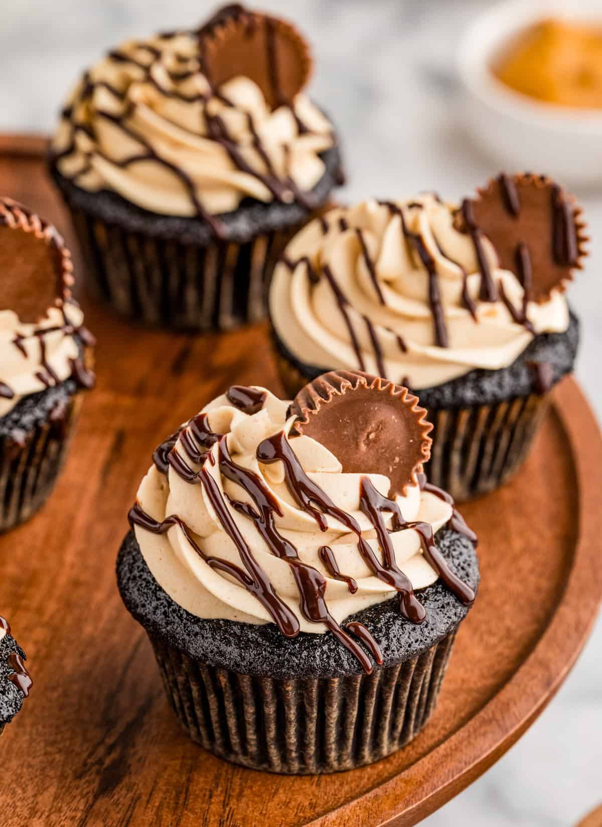 Chocolate Peanut Butter Cupcakes on cake stand.