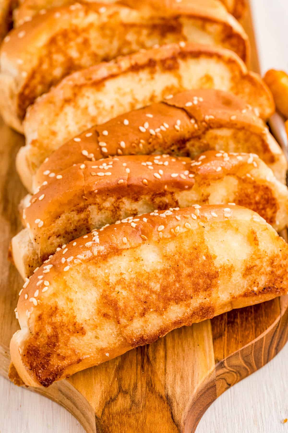 Copycat Raising Cane's Bread leaning against one another on wooden board.