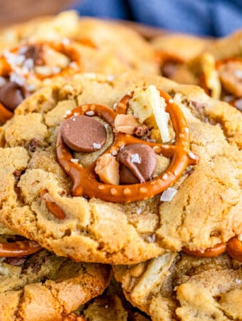 Close up square image of one stacked cookie showing all the ingredients on top.