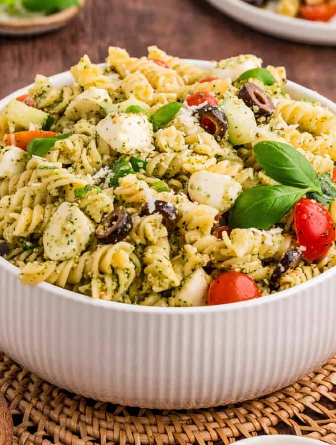 Close up square image of salad in white bowl.