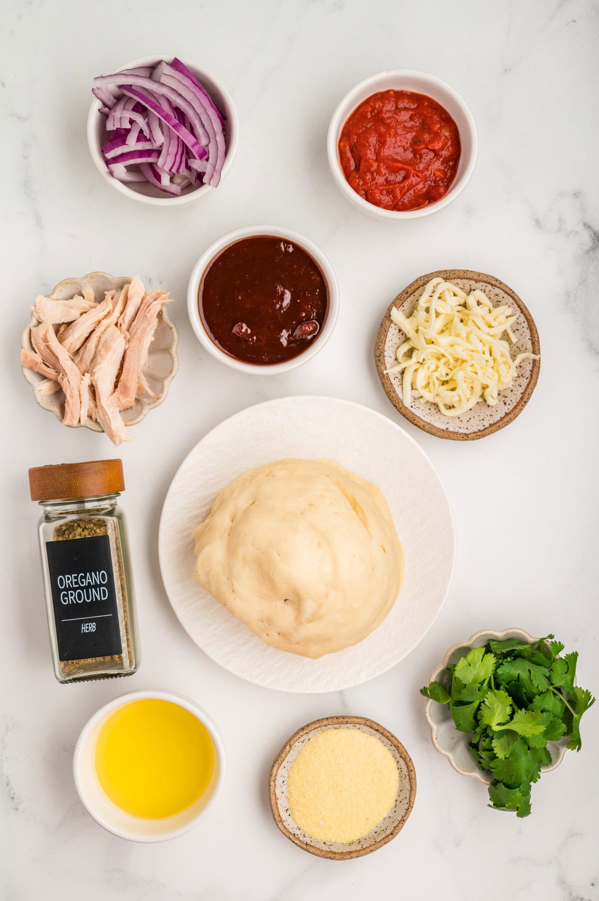 Ingredients needed to make a BBQ Chicken Pizza.