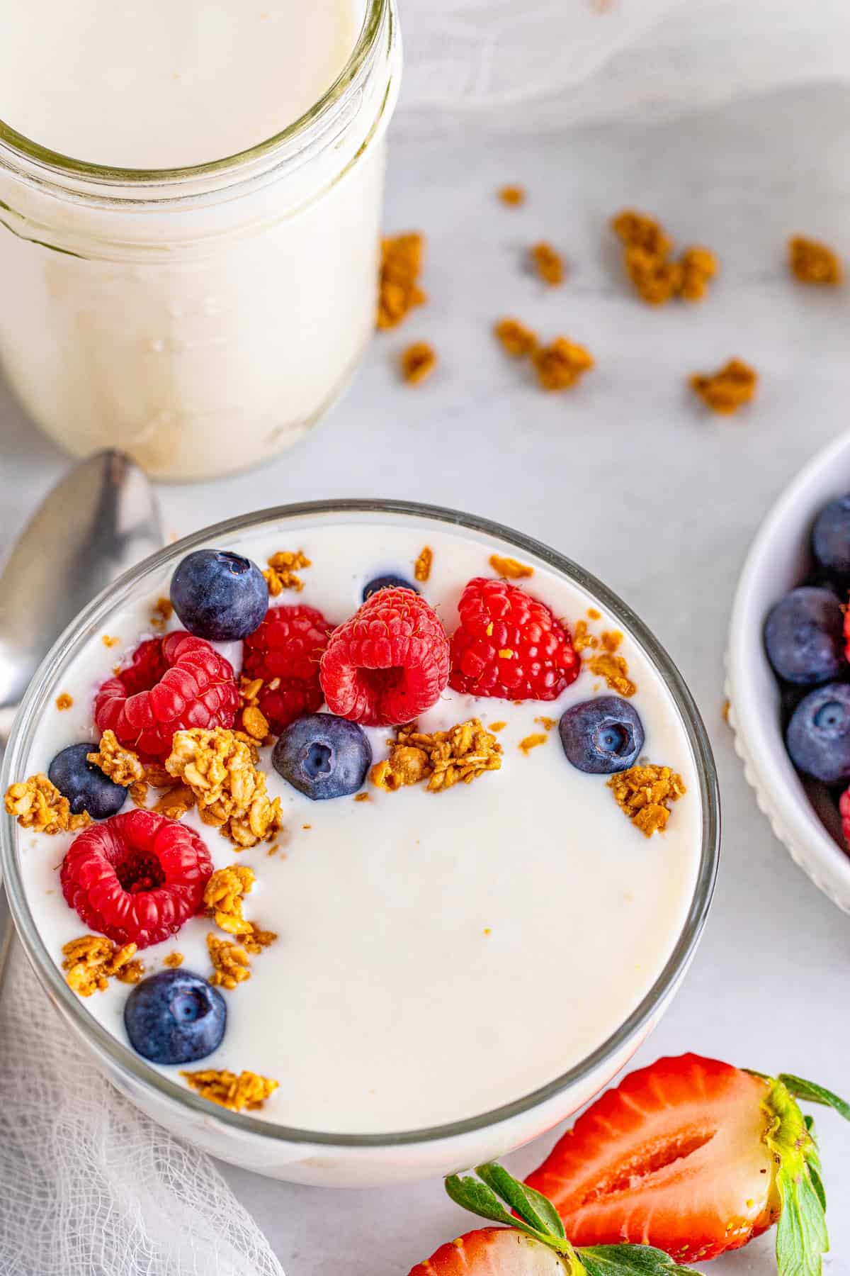 Overhead photo of finished Instant Pot Yogurt topped with granola and berries.
