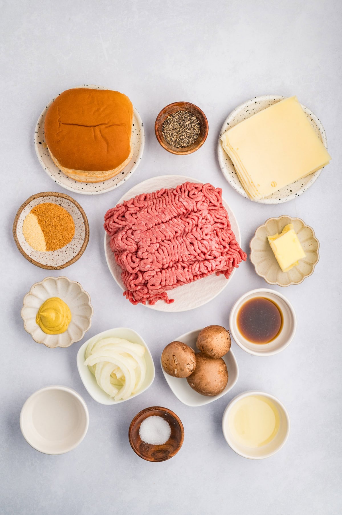 Ingredients needed to make a Mushroom and Swiss Burger.