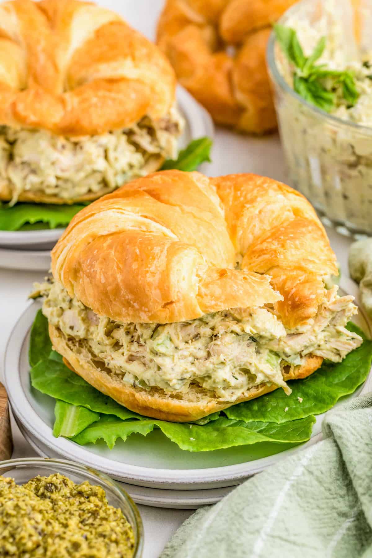 Pesto Chicken Salad served on a croissant with romaine lettuce.