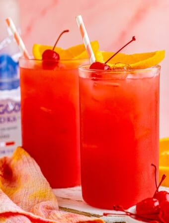 Close up square image of finished cocktails garnished.
