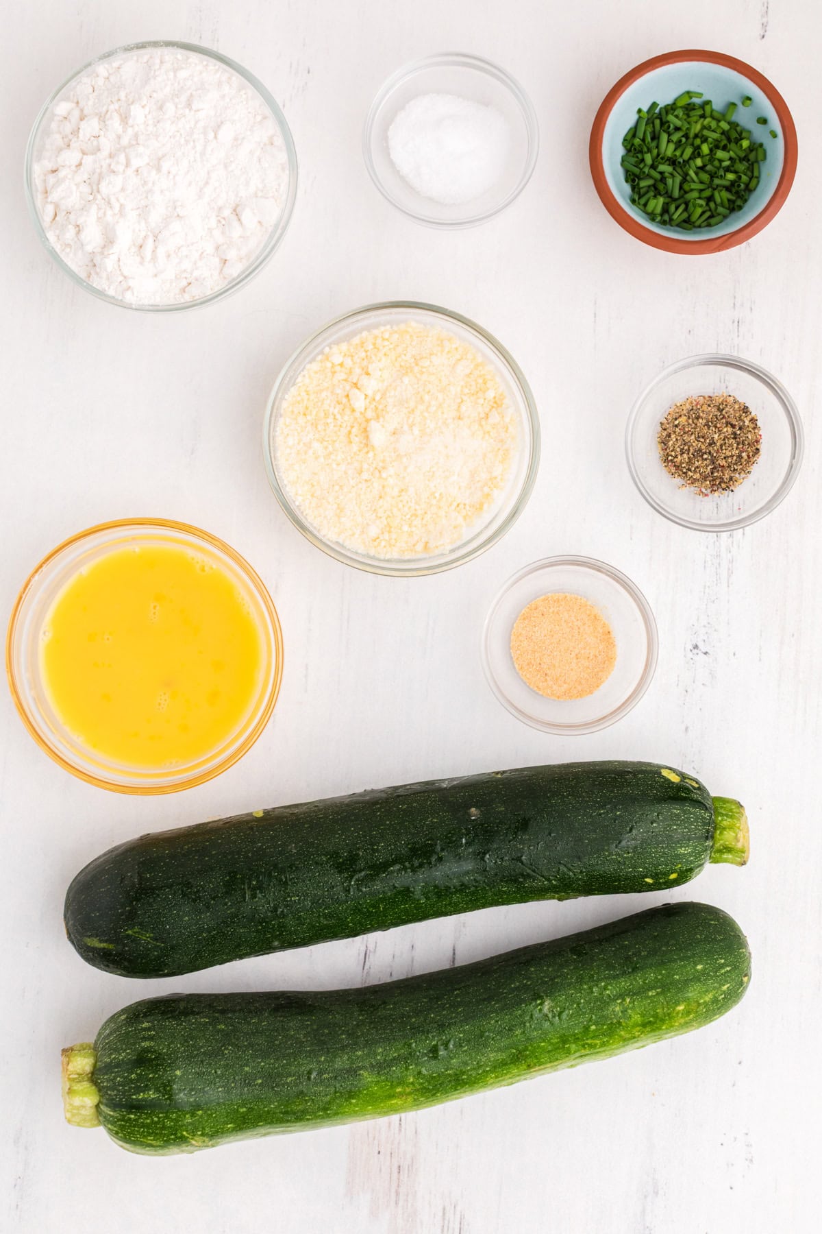 Ingredients needed to make Zucchini Fritters.