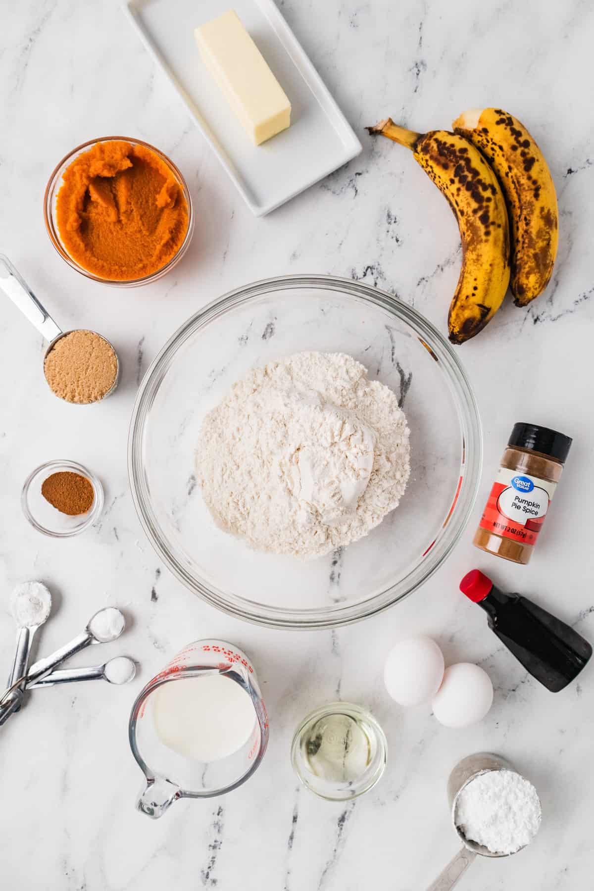Ingredients needed to make Bakery Style Jumbo Pumpkin Banana Muffins.