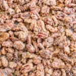 Close up square photo of pecans on sheet pan finished.