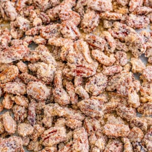 Close up square photo of pecans on sheet pan finished.
