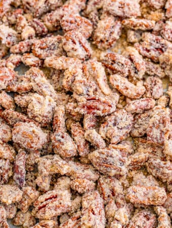 Close up square photo of pecans on sheet pan finished.