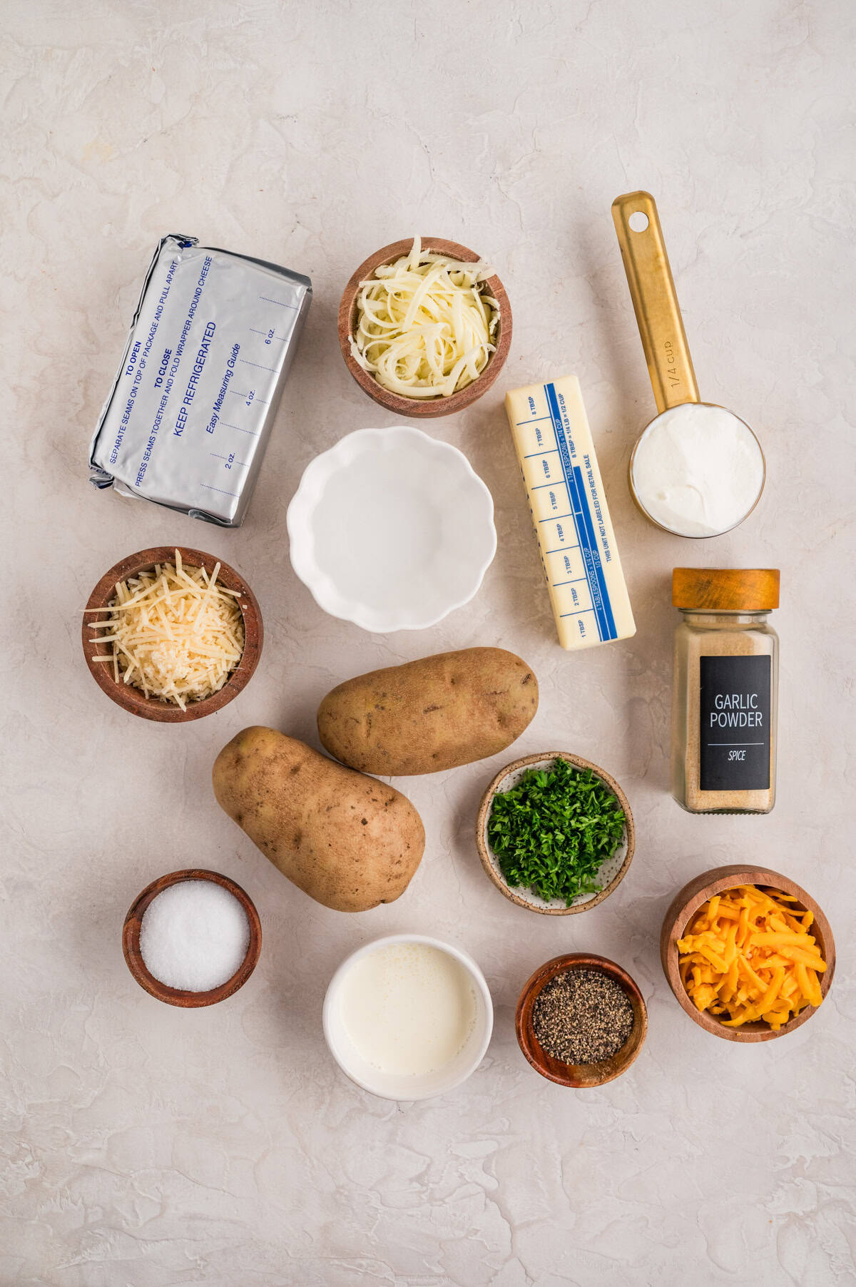 Ingredients needed to make Cheesy Mashed Potatoes.