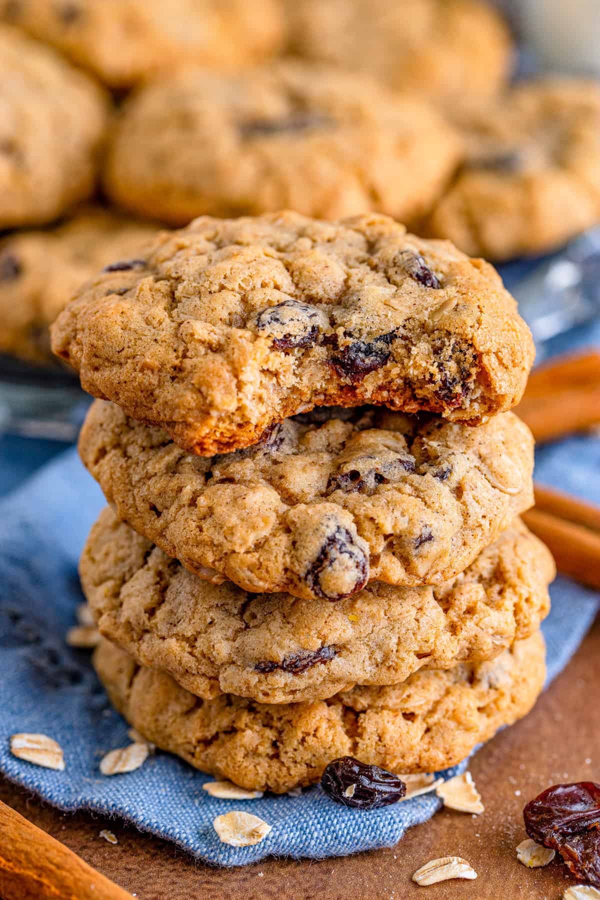 Four stacked cookies with top cookie having a bite taken out of it.